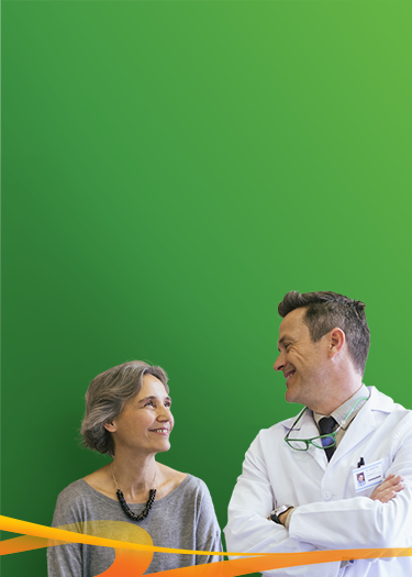 Stock Photo of Doctor Smiling at Patient